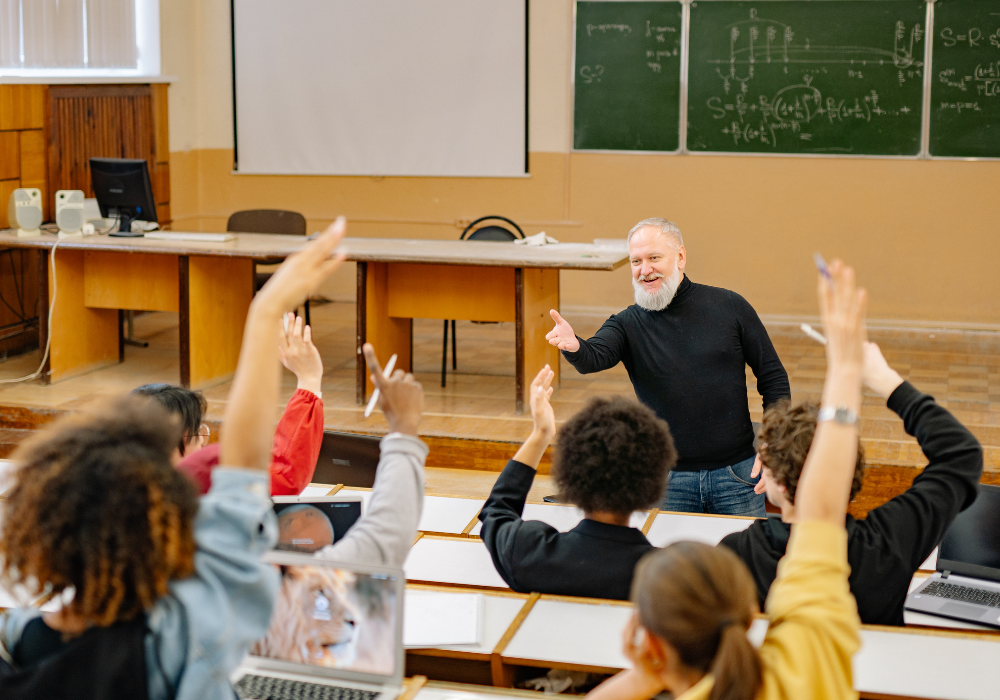 professor-teaching-gallery Study abroad students raising their hands in class