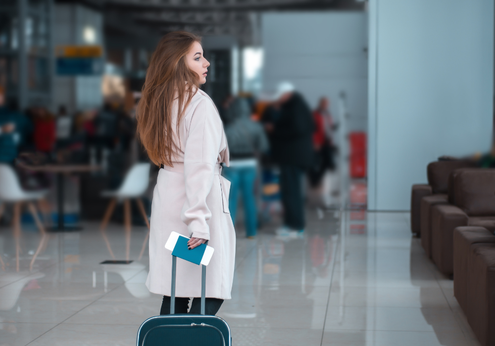 student-suitcase-aiport-gallery Student walking through airport to her study abroad flight