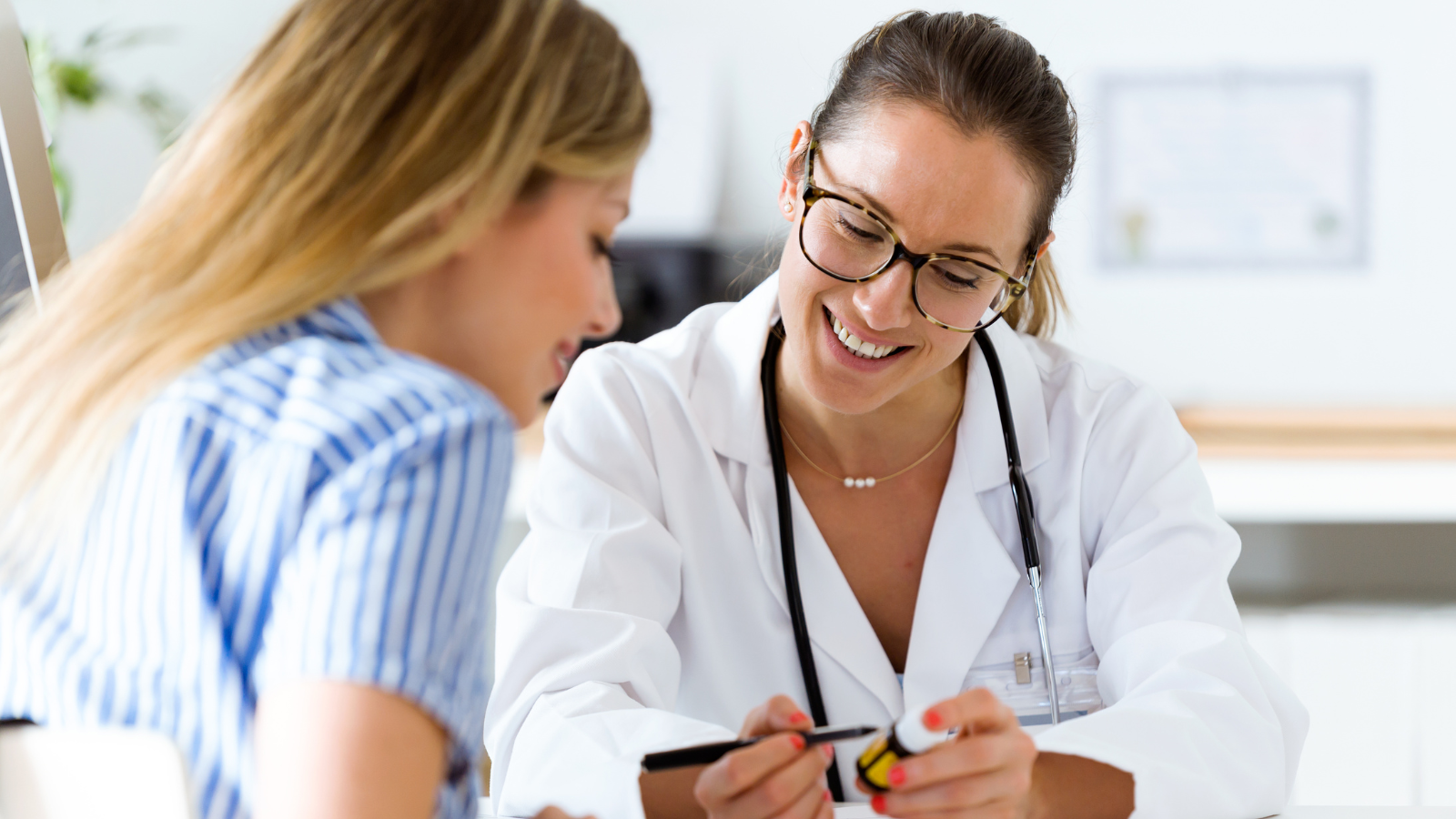 Doctor explains prescription directions to study abroad student