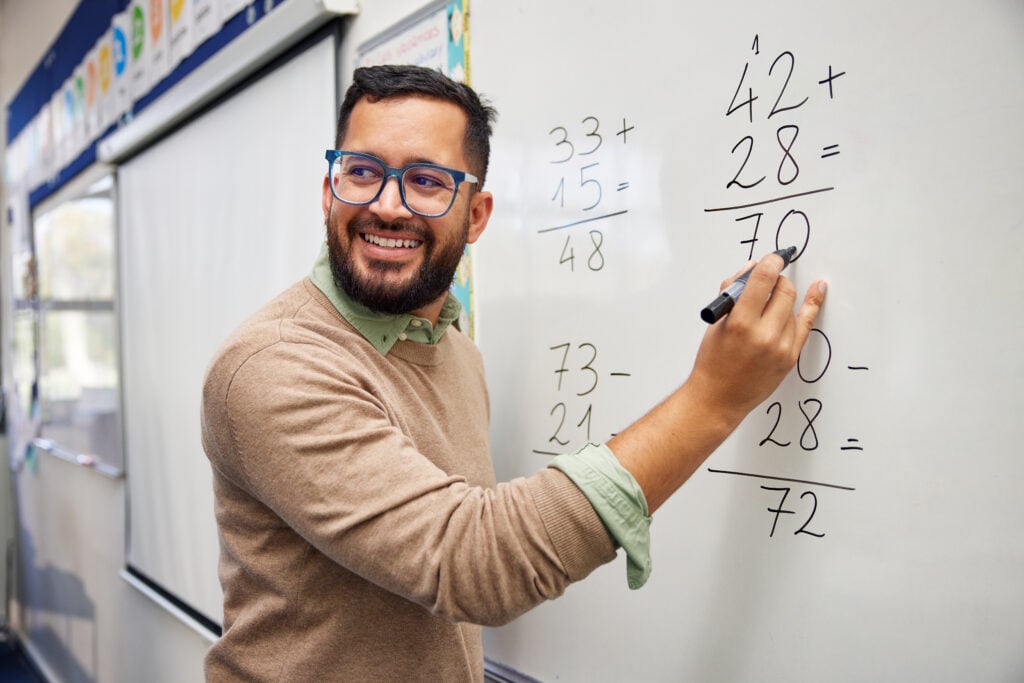 Male teacher explaining math in class